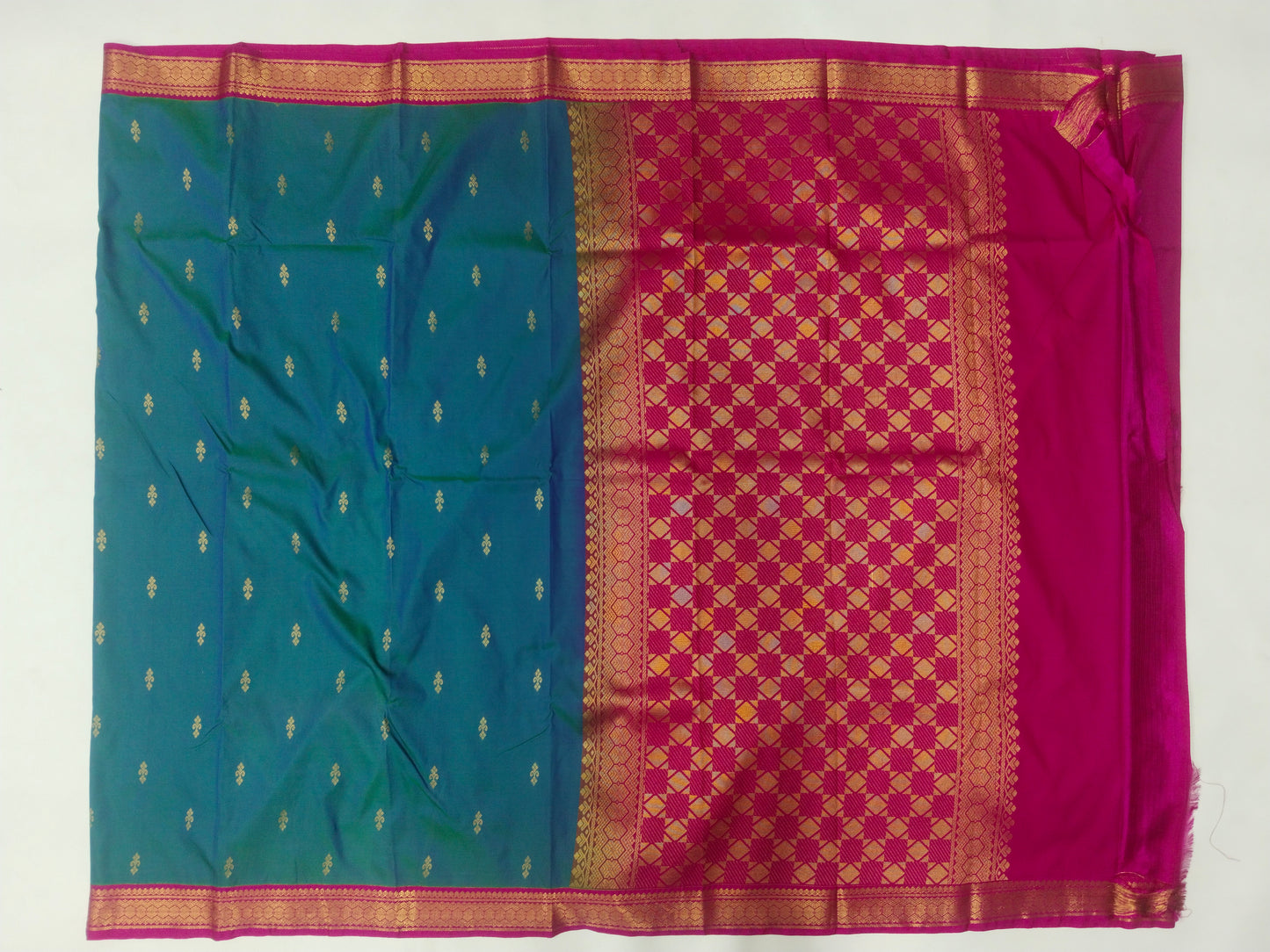 Semi Kanchipuram silk saree with small buta with contrast blouse and gold zari border with rich pallu-veena silk